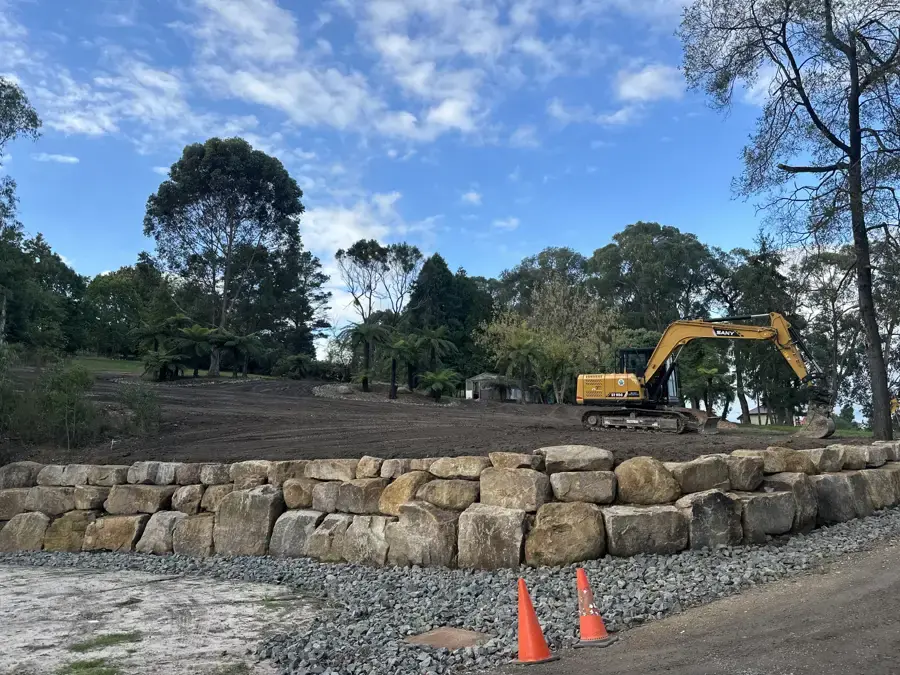 Rock retaining wall built by Entire Excavations